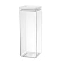 Clear glass storage jar with a white lid on a white background