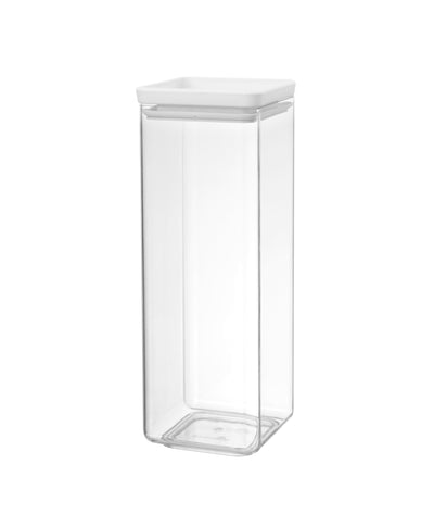 Clear glass storage jar with a white lid on a white background