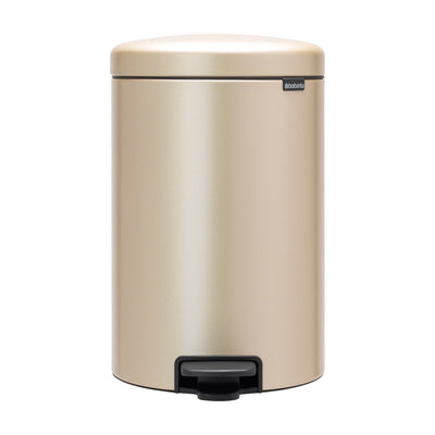 Beige trash can with a black pedal on a white background